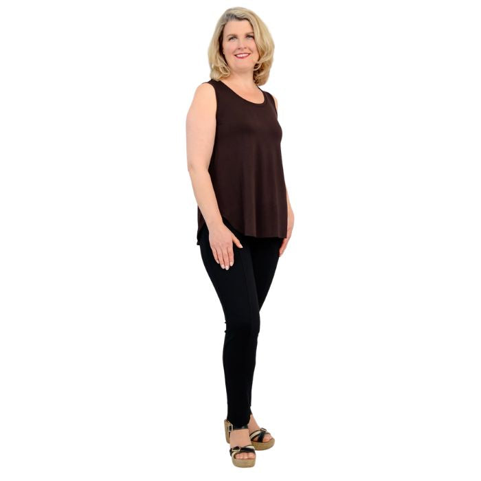female model wearing coffee brown jazz tank top and black nadia pants front view on white background