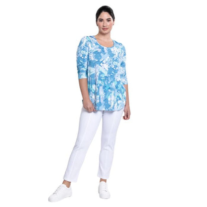 female model wearing denim cloud print jazz top and white nadine croppped pants front view on white background