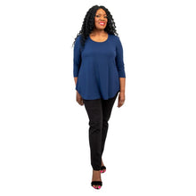 female model wearing jazz indigo blue three quarter sleeve top and nadia black pants front view on white background