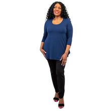 female model wearing jazz indigo blue three quarter sleeve top and nadia black pants front view on white background