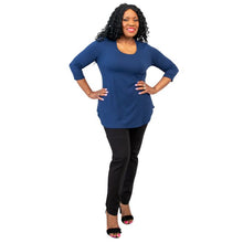 female model wearing jazz indigo blue three quarter sleeve top and nadia black pants front view on white background