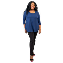 female model wearing jazz indigo blue three quarter sleeve top and nadia black pants front view on white background