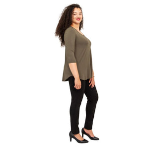 female model wearing jazz khaki green three quarter sleeve top and nadia black pants side view on white backround