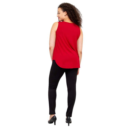 female model wearing lipstick red jazz tank top and black nadia pants back view on white background