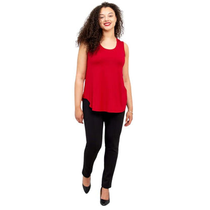 female model wearing lipstick red jazz tank top and black nadia pants front view on white background