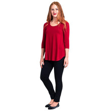 female model wearing jazz lipstick red  three quarter sleeve top and nadia black pants sifde view on white background