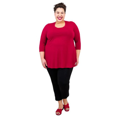 female model wearing jazz lipstick red  three quarter sleeve top and nadine cropped black pants front view on white background