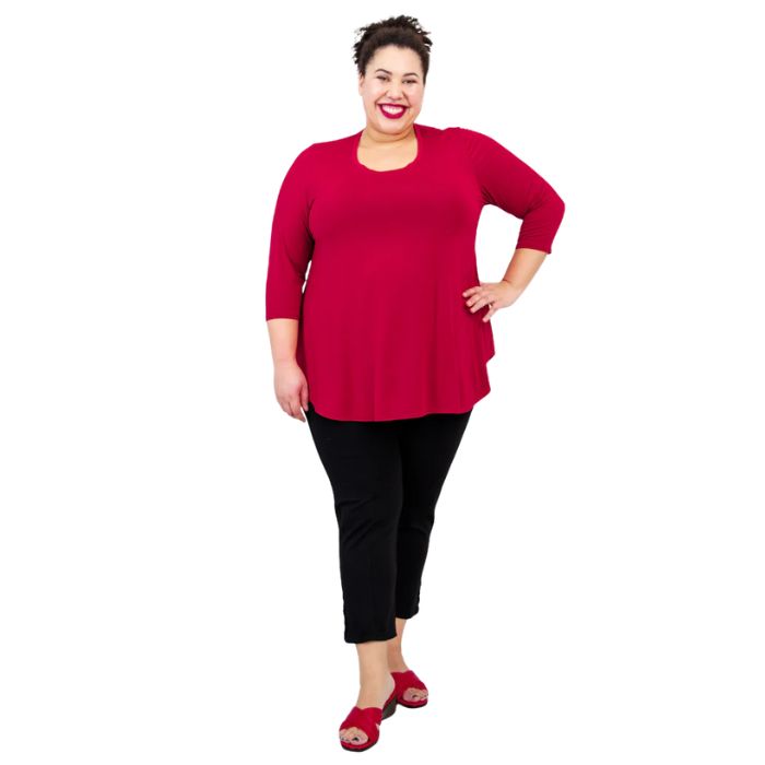 female model wearing jazz lipstick red  three quarter sleeve top and nadine cropped black pants front view on white background