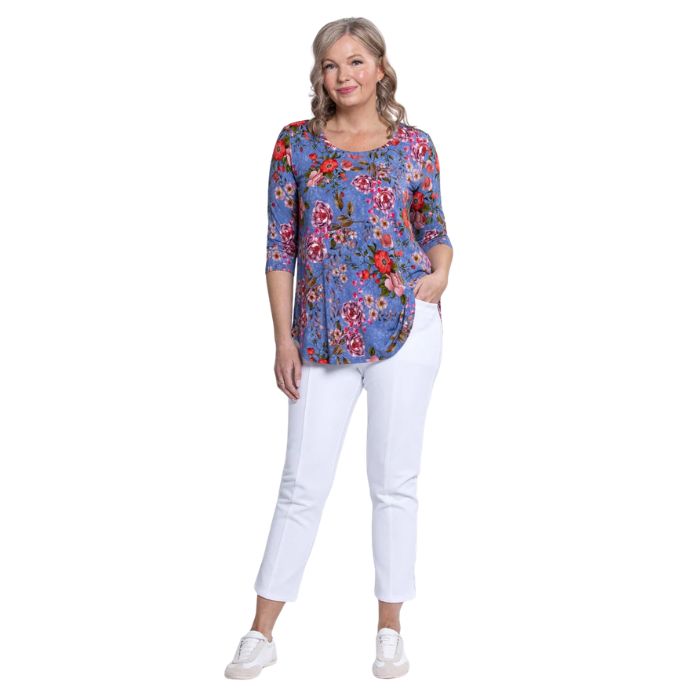 female model wearing jazz red rosebud print three quarter sleeve top and white nadine cropped pants front view on white background