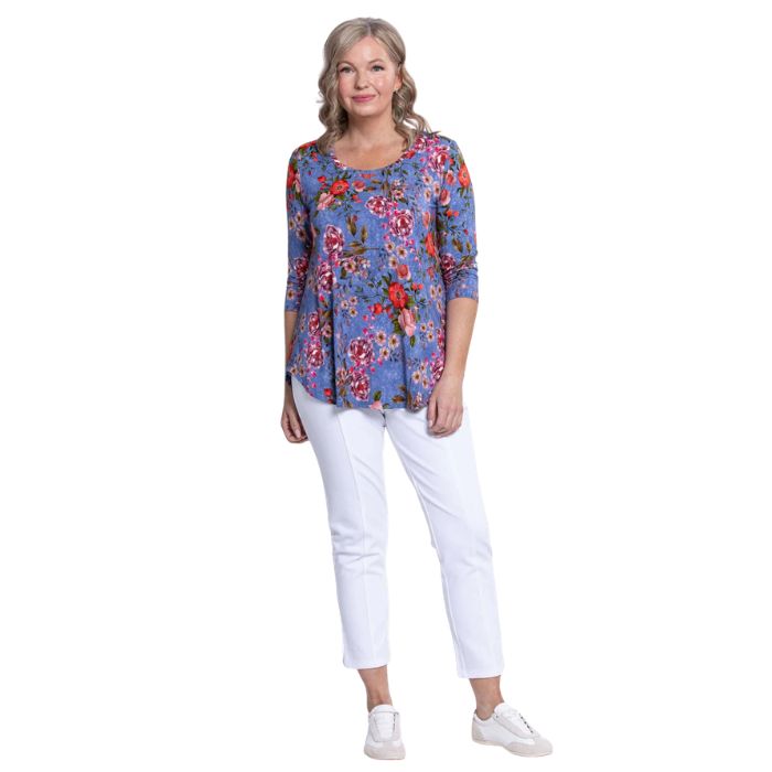 female model wearing jazz red rosebud print three quarter sleeve top and white nadine cropped pants front view on white background