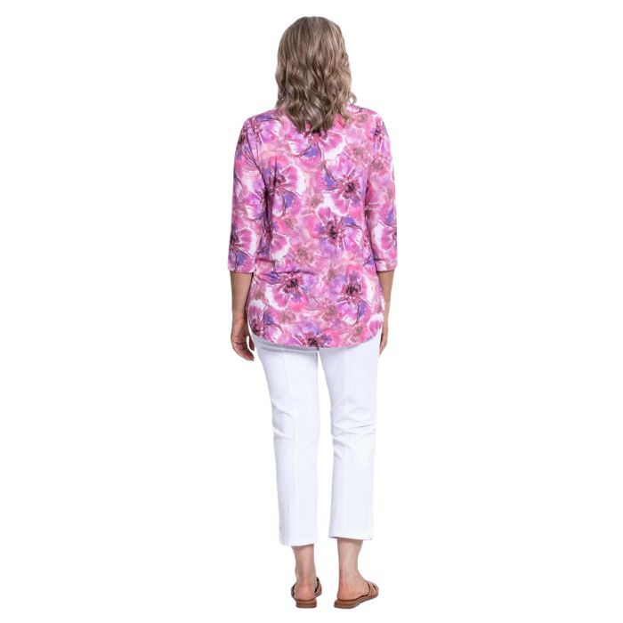 female model wearing jazz royale cardiff print three quarter sleeve top and white nadine cropped pants back view on white background