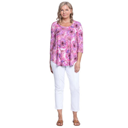 female model wearing jazz royale cardiff print three quarter sleeve top and white nadine cropped pants front view on white background