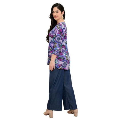 female model wearing jazz royale peacock print three quarter sleeve top and denim blue parker pants side view on white background
