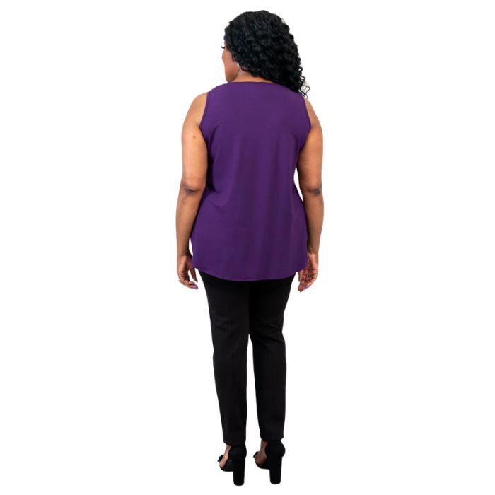 female model wearing royale purple jazz tank top and black nadia pants back view on white background