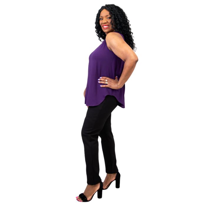 female model wearing royale purple jazz tank top and black nadia pants side view on white background