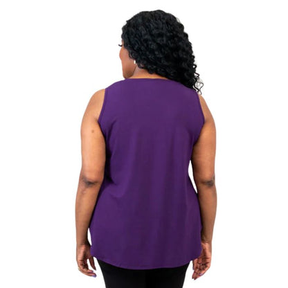 female model wearing royale purple jazz tank top and black nadia pants back view on white background