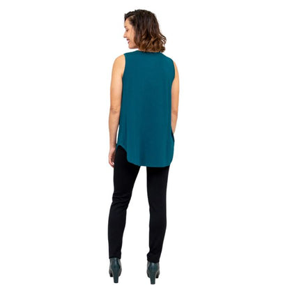 female model wearing teal green jazz tank top and black nadia pants back view on white background