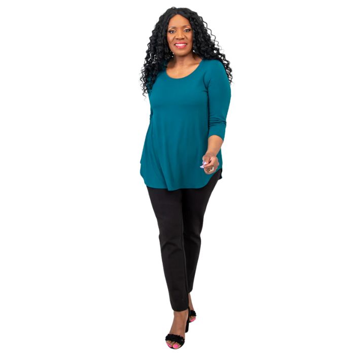 female model wearing jazz teal green three quarter sleeve top and nadia black pants front view on white background