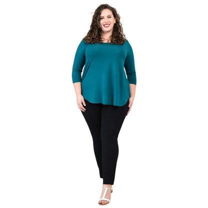 female model wearing jazz teal green three quarter sleeve top and nadia black pants front view on white background