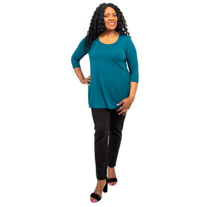 female model wearing jazz teal green three quarter sleeve top and nadia black pants front view on white background