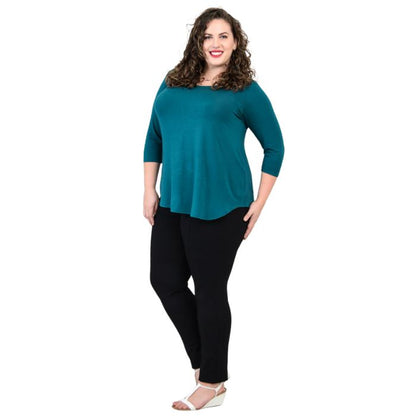 female model wearing jazz teal green three quarter sleeve top and nadia black pants side view on white background