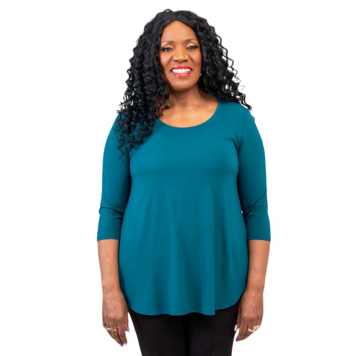 top half of female model wearing jazz teal green three quarter sleeve top front view on white background