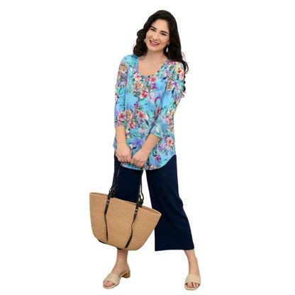 female model wearing jazz teal nectar print three quarter sleeve top and indigo blue landon capri pants front view on white background