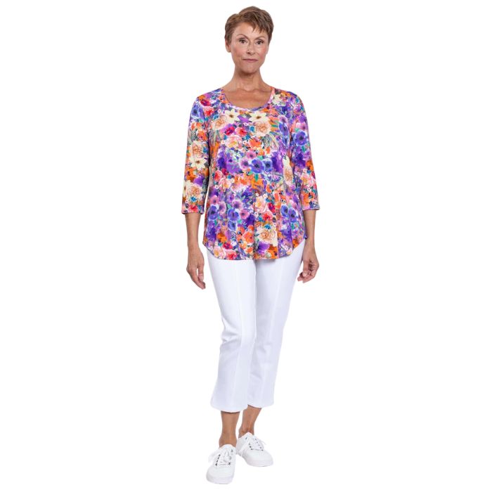 female model wearing jazz violet fiesta print three quarter sleeve top and white nadine cropped pants front view on white background