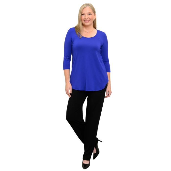 woman wearing violet purple jazz three quarter sleeve top and black clair pants front view set on a white background