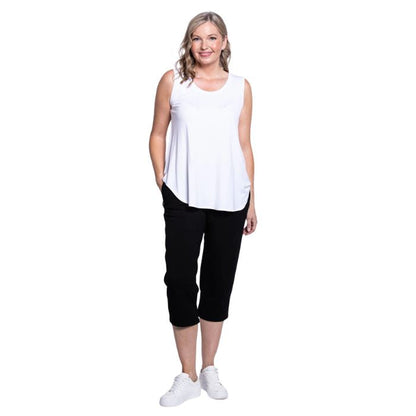 female model wearing white jazz tank top and black susan cropped pants front view on white background