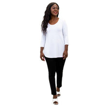 female model wearing jazz white three quarter sleeve top and nadia black pants front view on white background