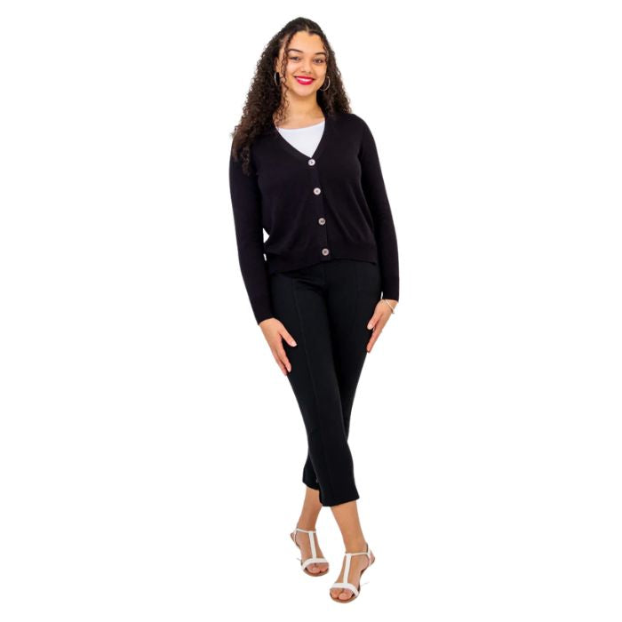 female model wearing black jessica button up cardigan sweater white reanna tank top and black nadine cropped pants front view on white background