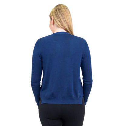 top of female model wearing jessica indigo blue button up cardigan sweater back view on white background