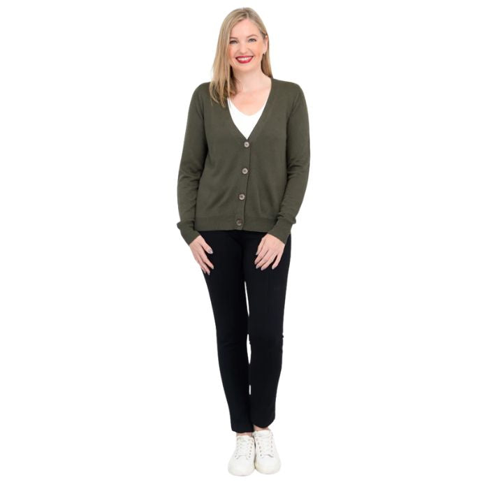 female model wearing khaki green jessica button up cardigan sweater, white reanna tank top and black nadia pants front view on white background