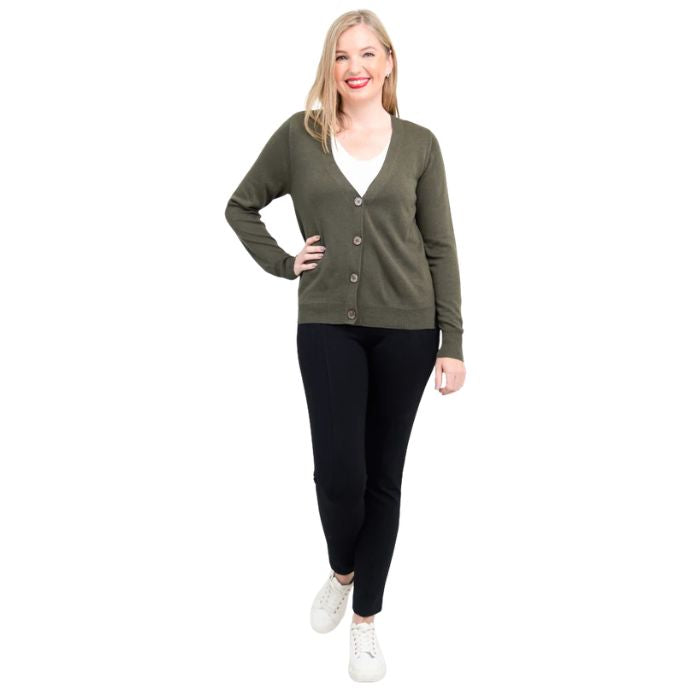 female model wearing khaki green jessica button up cardigan sweater, white reanna tank top and black nadia pants front view on white background
