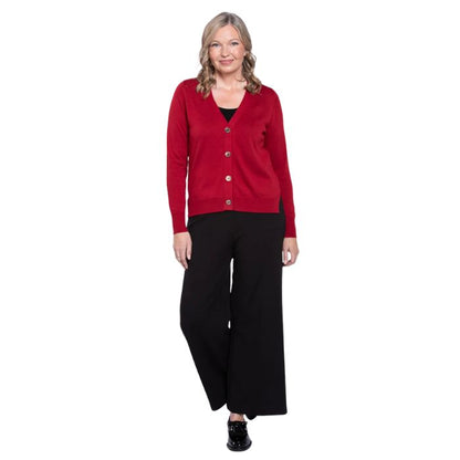 female model wearing lipstick red jessica button up cardigan sweater, black reanna tank top and black landon capri pants front view on white background