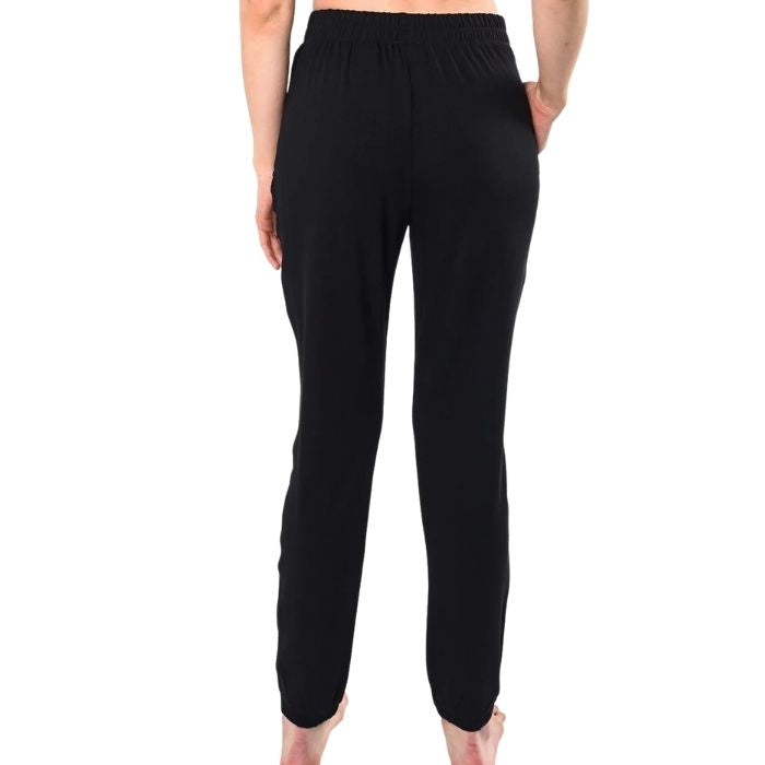 female model wearing black julie zippered joggers back view on white background