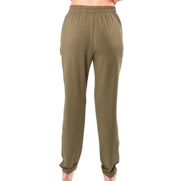 female model wearing moss green julie zippered joggers back view on white background