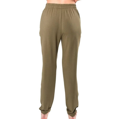 female model wearing moss green julie zippered joggers back view on white background