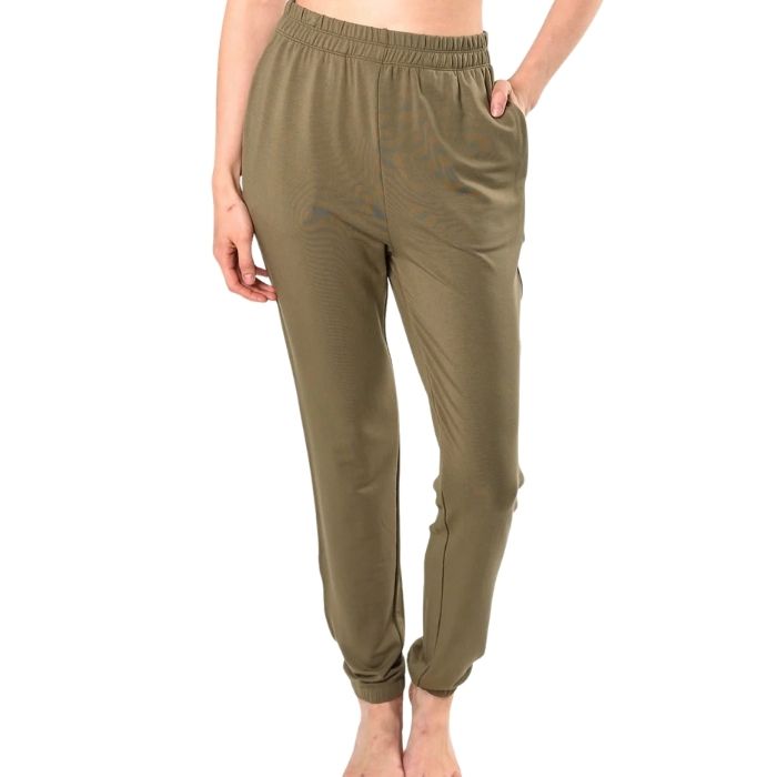 female model wearing moss green julie zippered joggers front view on white background