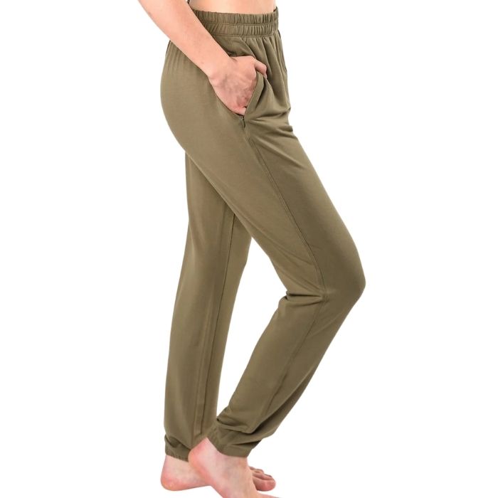 female model wearing moss green julie zippered joggers side view on white background