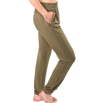 female model wearing moss green julie zippered joggers side view on white background