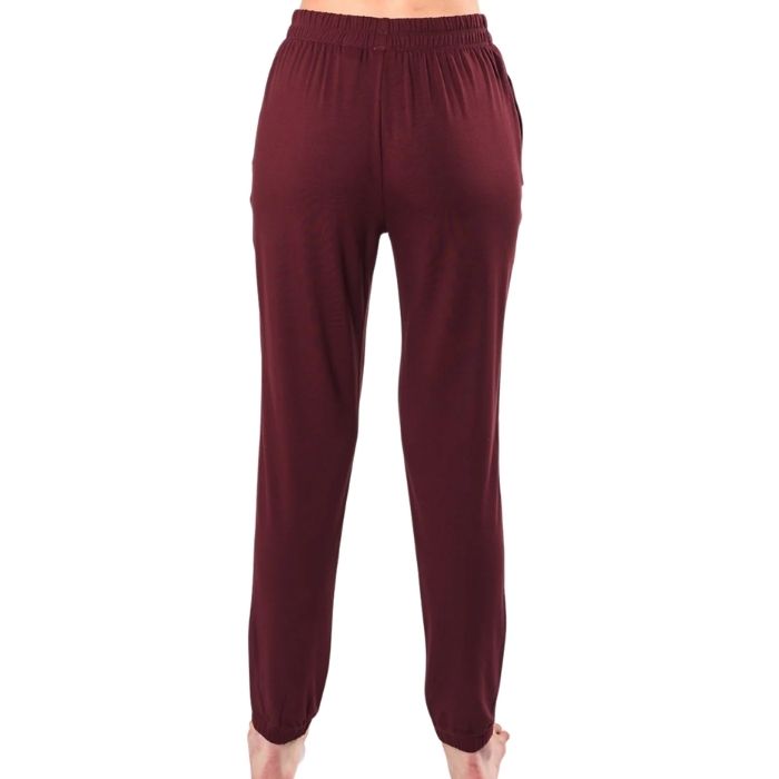 female model wearing wine red julie zippered joggers back view on white background