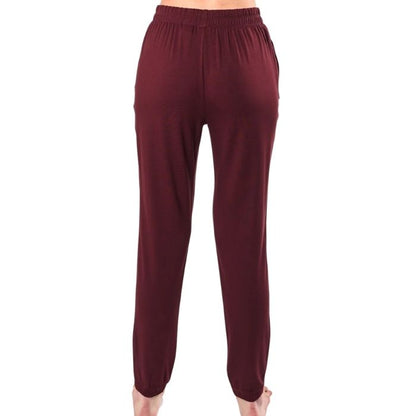 female model wearing wine red julie zippered joggers back view on white background