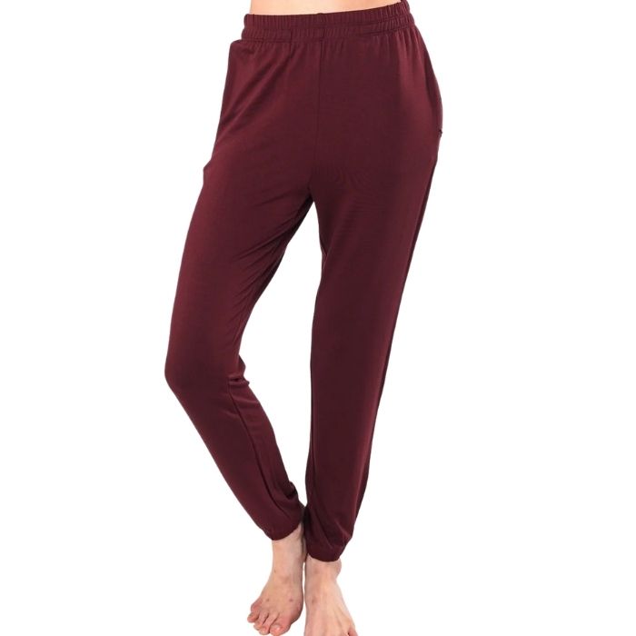 female model wearing wine red julie zippered joggers front view on white background