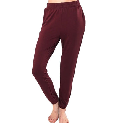 female model wearing wine red julie zippered joggers front view on white background