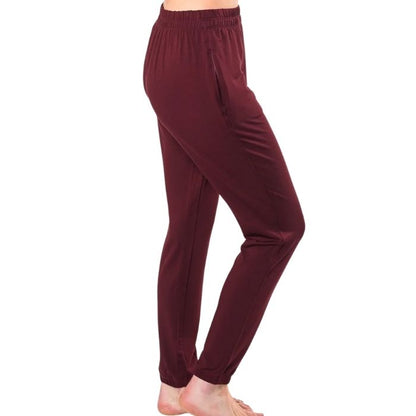 female model wearing wine red julie zippered joggers side view on white background