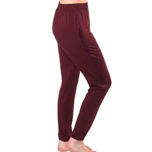 female model wearing wine red julie zippered joggers side view on white background