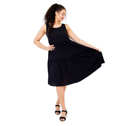 female model wearing black juni dress front veiw on white background