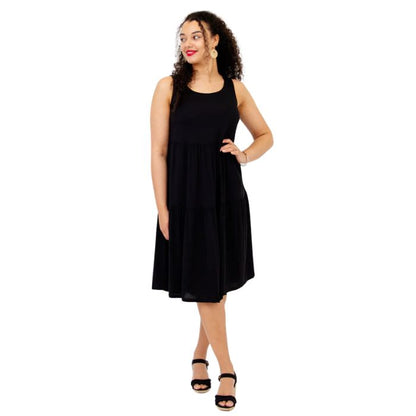 female model wearing black juni dress front veiw on white background